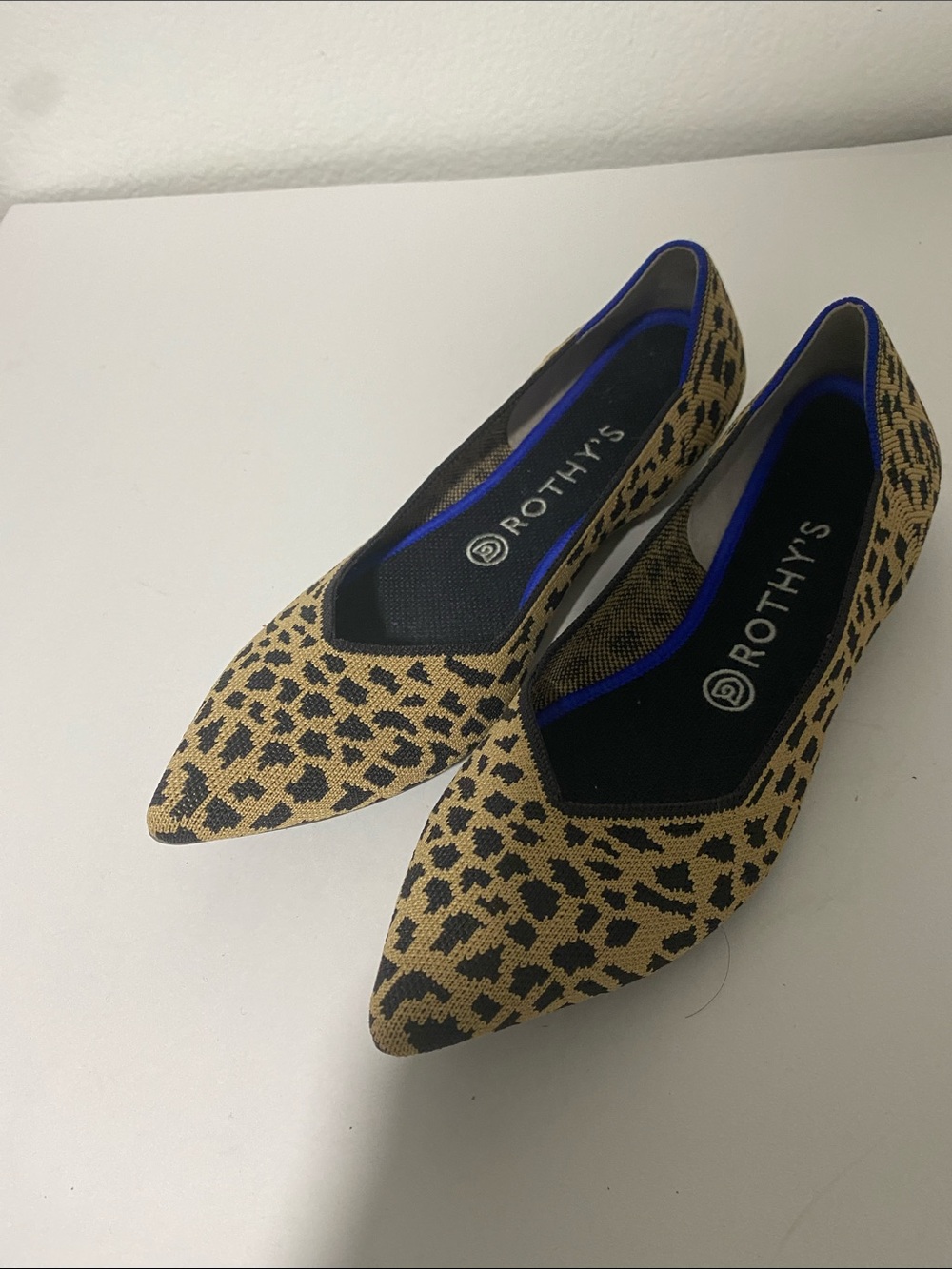 Rothy's Leopard-Print Pointed Flats in Tan and Black with Blue Trim
